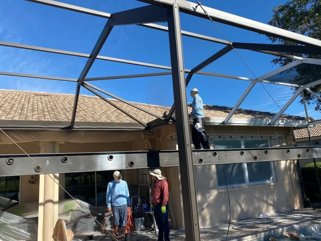 Workers assembling large outdoor structure