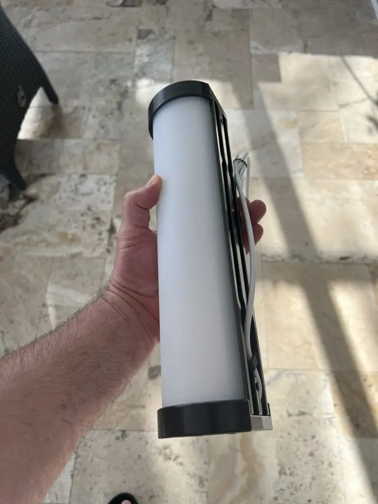LED column light fixture for pool cage posts, held before installation